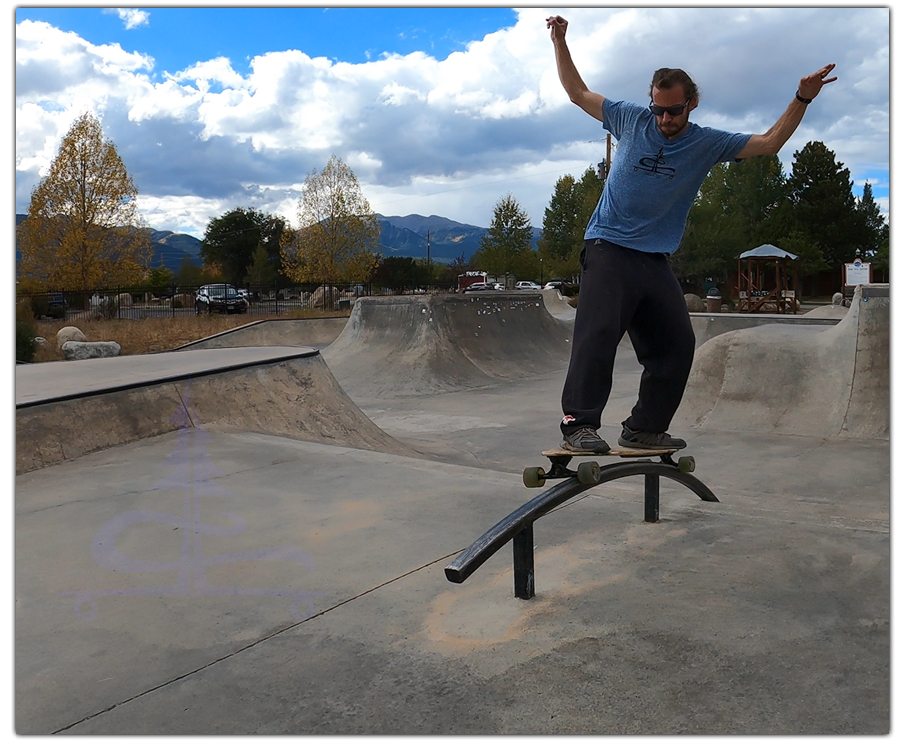 grinding the rail on a longboard 